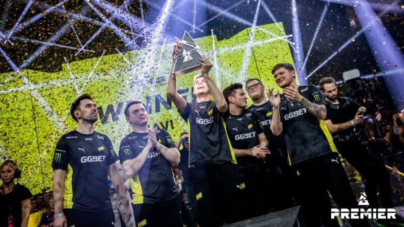 The roster for NAVI hold up the Blast Premier trophy in celebration after winning the Fall Finals